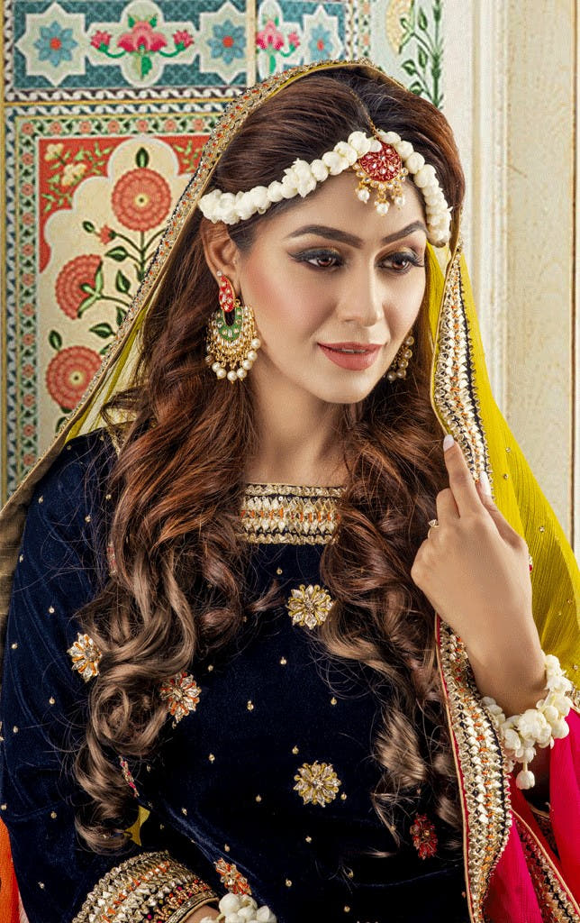women gold floral embroidered velvet lehenga choli Pakistan wedding wear