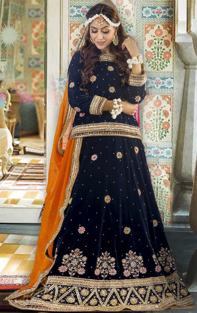 women gold floral embroidered velvet lehenga choli Pakistan wedding wear
